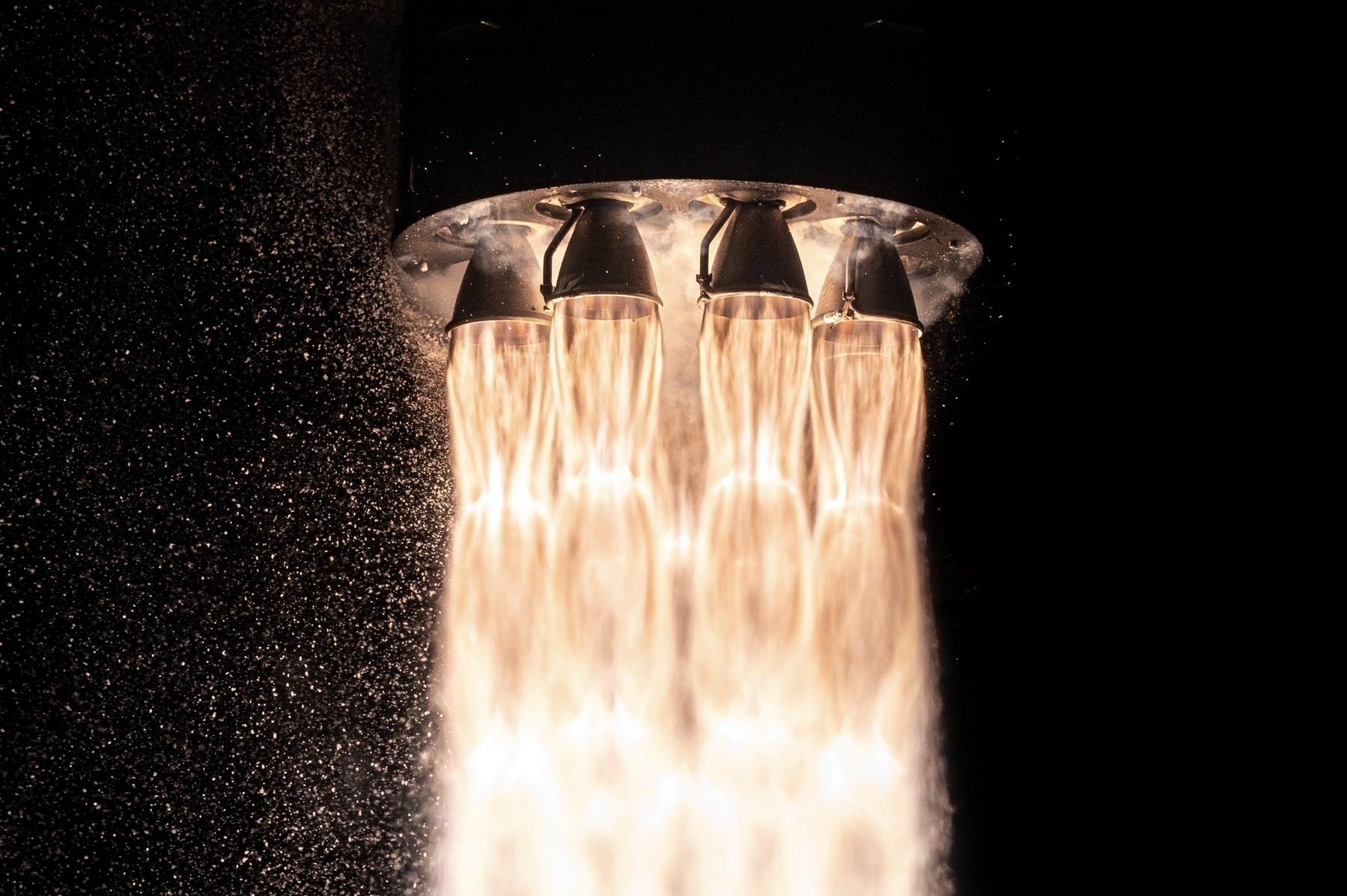 Photo of a Rocket Lab Electron's rocket engines during launch.
